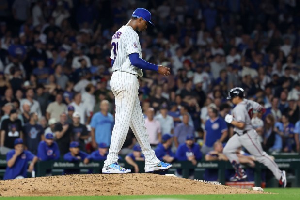 Chicago Cubs relief pitcher Edward Cabrera stands on the mound as Atlanta Braves catcher Drake Baldwin rounds the bases after hitting a two-run home run in the ninth inning of a game at Wrigley Field in Chicago on Sept. 15, 2026. (Chris Sweda/Chicago Tribune)
