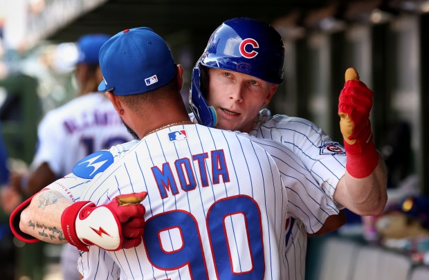 Cubs center fielder Pete Crow-Armstrong is congratulated by coach Jonathan Mota in the dugout after hitting a solo home run in the sixth inning against the Giants at Wrigley Field on June 6, 2026. (Chris Sweda/Chicago Tribune)