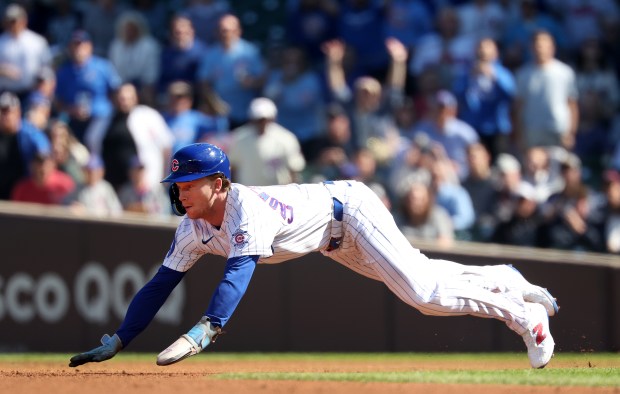Chicago Cubs center fielder Pete Crow-Armstrong (4) steals second base in the first inning of a game against the Miami Marlins at Wrigley Field in Chicago on Sept. 24, 2026. With it being the 40th stolen base of the year for Crow-Armstrong, he joined the exclusive 40 homer/40 stolen base club. (Chris Sweda/Chicago Tribune)