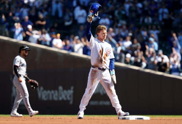 Cubs center fielder Pete Crow-Armstrong acknowledges applause after stealing second base in the first inning against the Marlins at Wrigley Field on Sept. 24, 2026. With the steal, he became the seventh player in MLB history to reach 40 home runs and 40 stolen bases in a season. (Chris Sweda/Chicago Tribune)