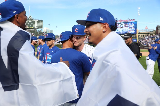 Pete Crow-Armstrong, center, and the Cubs celebrate after clinching a playoff spot Thursday, Sept. 24, 2026, at Wrigley Field. (Chris Sweda/Chicago Tribune)