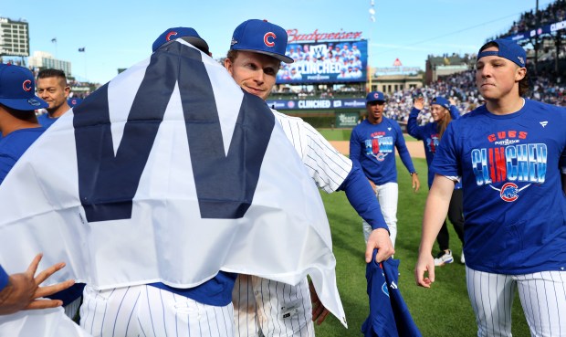 Pete Crow-Armstrong celebrates with teammates after the Cubs clinched a playoff spot with a victory against the Marlins on Thursday, Sept. 24, 2026, at Wrigley Field. (Chris Sweda/Chicago Tribune)