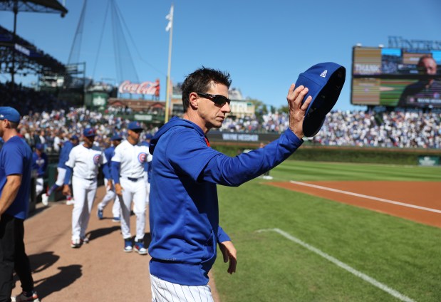 Cubs manager Craig Counsell waves over the Marlins bench while coming onto the field for the national anthem Thursday, Sept. 24, 2026, at Wrigley FIeld. (Chris Sweda/Chicago Tribune)