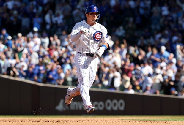 Cubs right fielder Seiya Suzuki celebrates as he rounds the bases after hitting a solo home run in the fifth inning against the Marlins on Thursday, Sept. 24, 2026, at Wrigley Field. (Chris Sweda/Chicago Tribune)