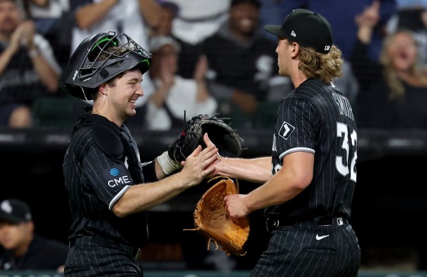 White Sox catcher Kyle Teel, left, and reliever Hagen Smith celebrate after retiring the Tigers in the top of the fifth inning Sept. 18, 2026, at Rate Field. (Chris Sweda/Chicago Tribune)
