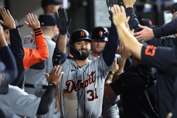 Tigers left fielder Riley Greene high-fives teammates in the dugout after hitting a two-run home run in the eighth inning against the White Sox on Sept. 18, 2026, at Rate Field. (Chris Sweda/Chicago Tribune)