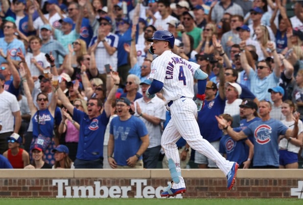 Cubs center fielder Pete Crow-Armstrong rounds the bases after hitting his third home run of the day, a three-run shot in the seventh inning against the Reds at Wrigley Field on Aug. 29, 2026. (John J. Kim/Chicago Tribune)