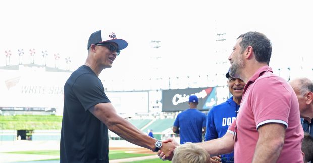 White Sox manager Will Venable, left, is greeted by minority owner Justin Ishbia during batting practice before a game against the Dodgers on June 12, 2026, at Rate Field. (John J. Kim/Chicago Tribune)