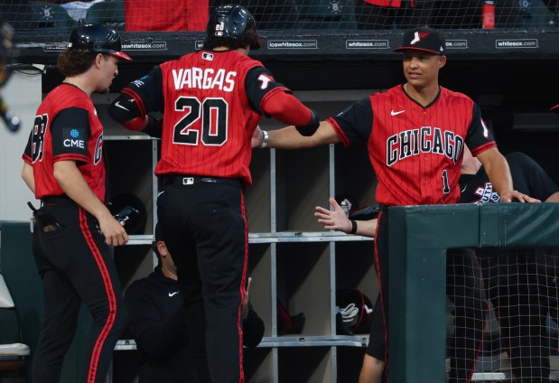 White Sox manager Will Venable, right, congratulates third baseman Miguel Vargas after a solo home run in the first inning against the Twins at Rate Field on Sept. 4, 2026, in Chicago. (John J. Kim/Chicago Tribune)