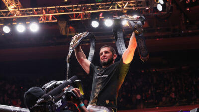 Nov 15, 2025; New York, NY, UNITED STATES; Islam Makhachev (blue gloves) acknowledges the crowd after defeating Jack Della Maddalena (not pictured) in the welterweight championship bout during UFC 322 at Madison Square Garden.