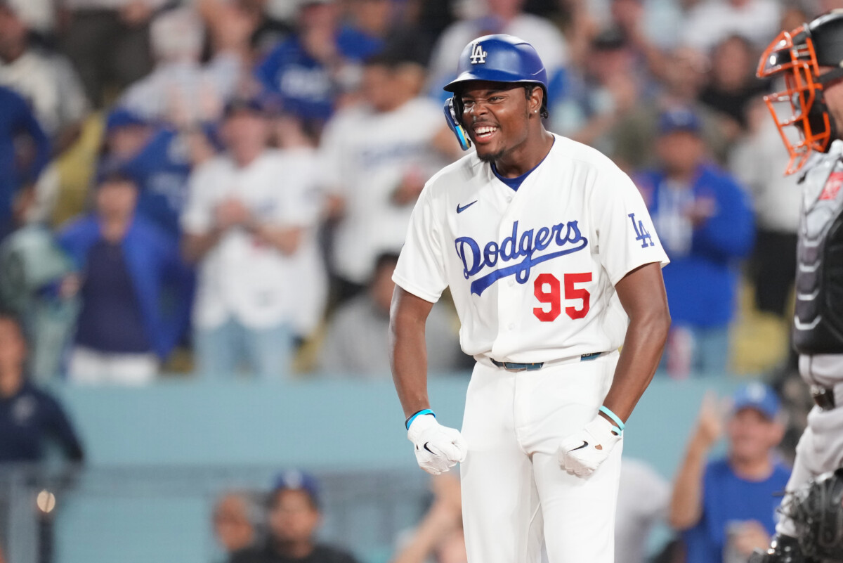 Sep 18, 2026; Los Angeles, California, USA;  Los Angeles Dodgers designated hitter Josue de Paula (95) celebrates after scoring on a two run home run by Los Angeles Dodgers shortstop Mookie Betts (not pictured) during the eighth inning against the San Francisco Giants at Dodger Stadium.  Mandatory Credit: Kirby Lee-Imagn Images