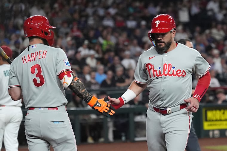 Bryce Harper (left) and Kyle Schwarber each drove in runs in the Phillies' win on Tuesday night in Arizona.