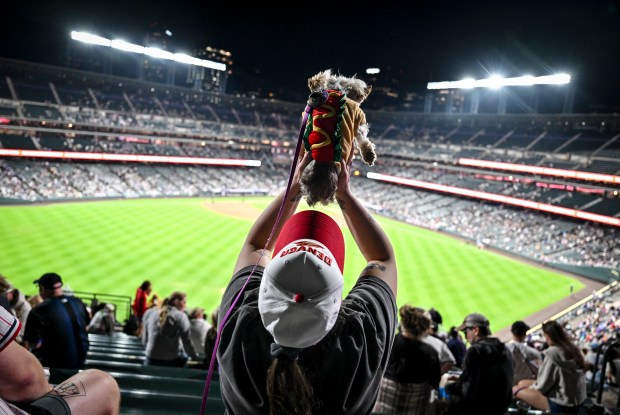 Nakia sports a hotdog costume as she watches the action...