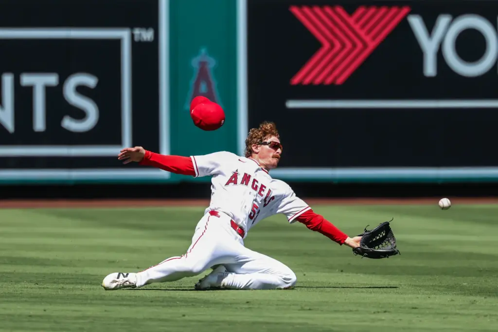 Aug 16, 2026; Anaheim, California, USA; Los Angeles Angels left fielder Wade Meckler (53) makes a sliding catch for the third out of the seventh inning at Angel Stadium. Mandatory Credit: William Navarro-Imagn Images