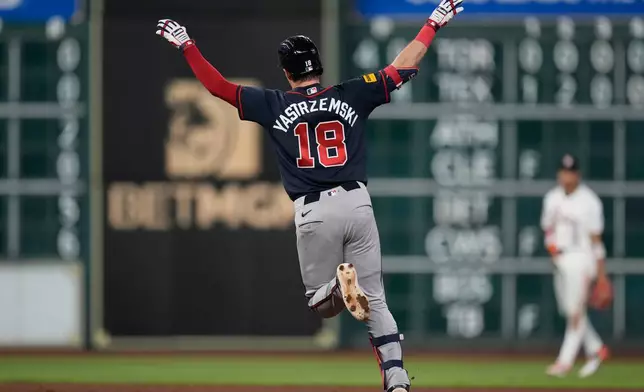 Atlanta Braves' Mike Yastrzemski celebrates after hitting a home run during the eighth inning of a baseball game against the Houston Astros in Houston, Saturday, Sept. 19, 2026. (AP Photo/Ashley Landis)