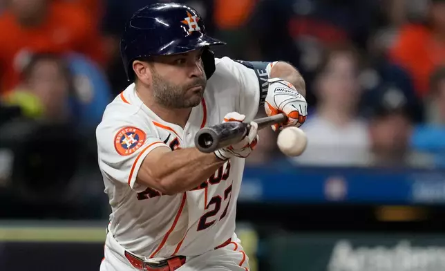 Houston Astros' Jose Altuve singles on a bunt during the eighth inning of a baseball game against the Atlanta Braves in Houston, Saturday, Sept. 19, 2026. (AP Photo/Ashley Landis)