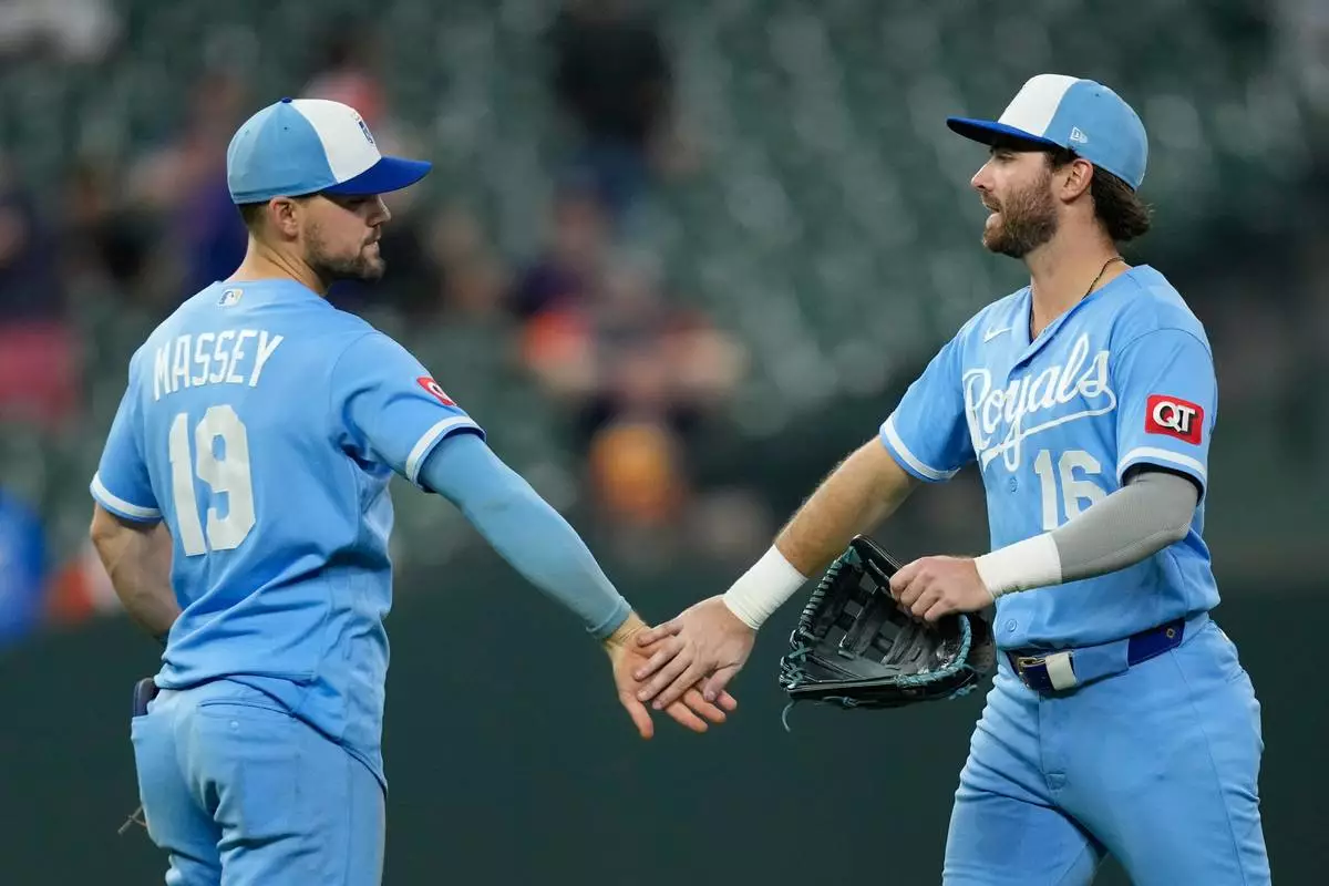Kansas City Royals' Michael Massey (19) and John Rave (16) celebrate after a baseball game against the Houston Astros Wednesday, Sept. 16, 2026, in Houston. (AP Photo/David J. Phillip)