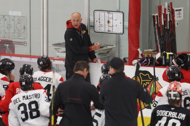 Coach Jeff Blashill talks to players during practice Thursday, Sept. 17, 2026, during training camp at the Blackhawks Ice Center. (Brian Cassella/Chicago Tribune)