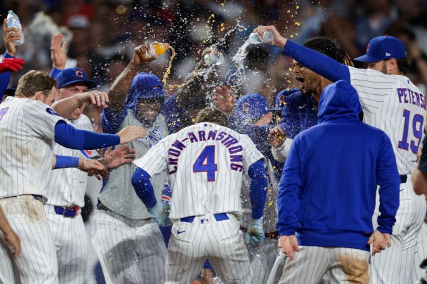 Cubs center fielder Pete Crow-Armstrong celebrates with his team after hitting a walk-off, two-run homer off the White Sox during the tenth inning at Wrigley Field, Aug. 17, 2026. (Armando L. Sanchez/Chicago Tribune)