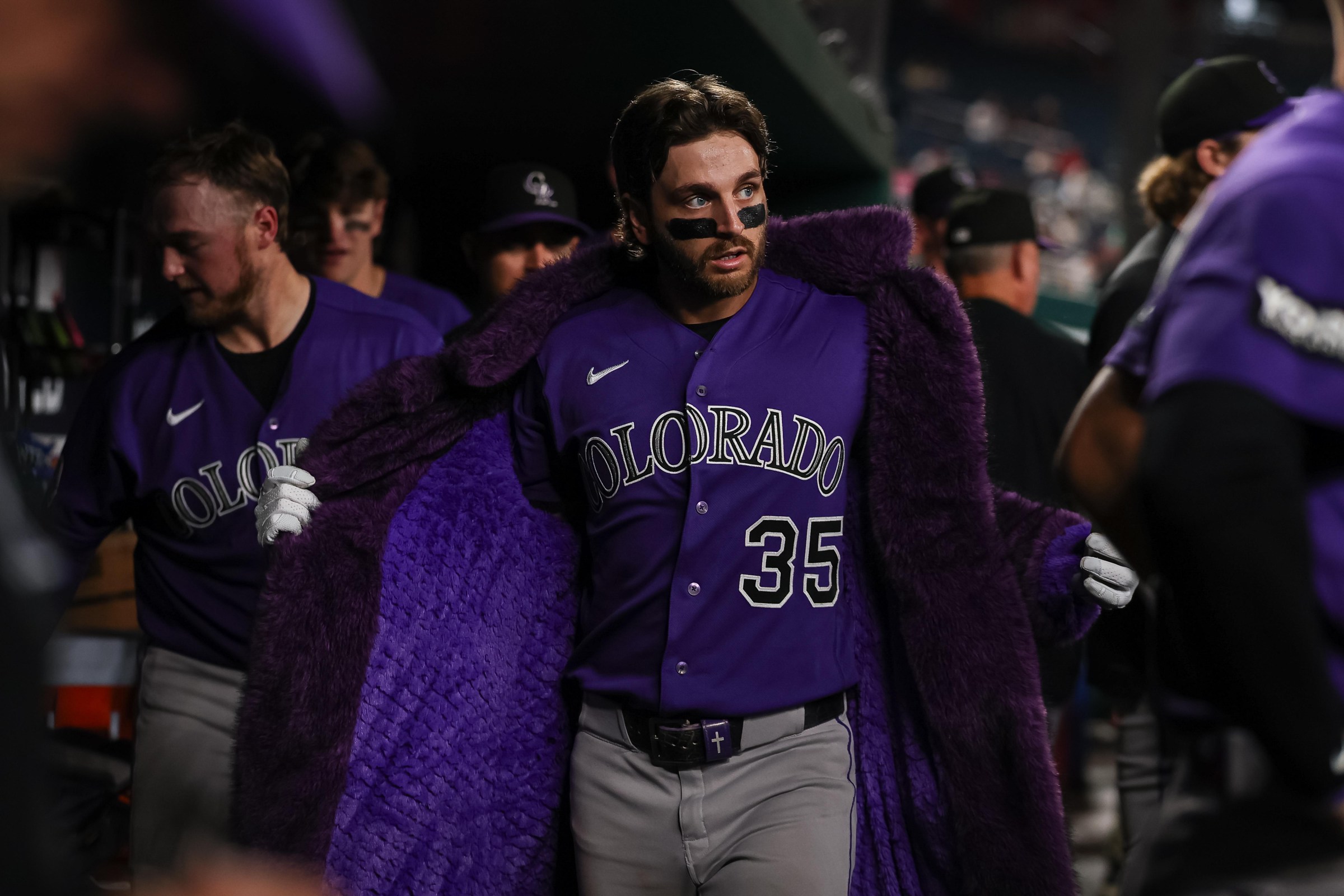 WASHINGTON, DC - AUGUST 26: Connor Norby #35 of the Colorado Rockies wears a purple home run jacket while celebrating with teammates in the dugout after hitting a grand slam home run against the Washington Nationals during the seventh inning at Nationals Park on August 26, 2026 in Washington, DC. (Photo by Scott Taetsch/Getty Images)