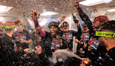Cleveland Guardians' Angel Martínez, center, celebrates with teammates after clinching a postseason playoff spot following a baseball game against the Boston Red Sox, Thursday, Sept. 24, 2026, in Boston. (AP Photo/Charles Krupa)
