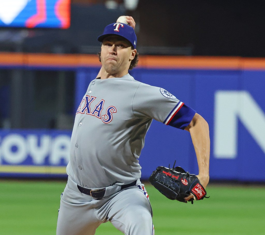 Texas Rangers pitcher Jacob deGrom throwing a pitch.