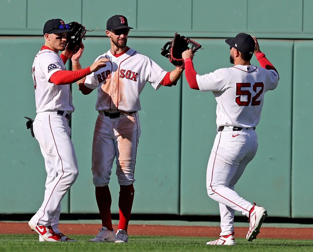 Boston Red Sox outfielders, from left, Jarren Duran, Eli White and Wilyer Abreu celebrate their 5-2 win against the Los Angeles Angels. Matt Stone/Boston Herald