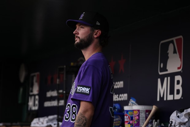 WASHINGTON, DC - AUGUST 25: Mason Adams #38 of the Colorado Rockies looks on from the dugout before his major league debut against the Washington Nationals at Nationals Park on August 25, 2026 in Washington, DC. (Photo by Scott Taetsch/Getty Images)