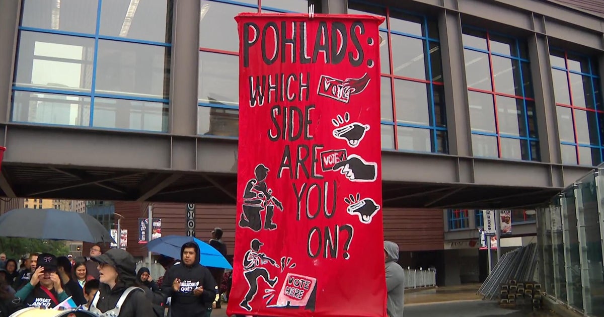 Protesters rally outside Target Field to push Pohland family to "stand up for democracy"
