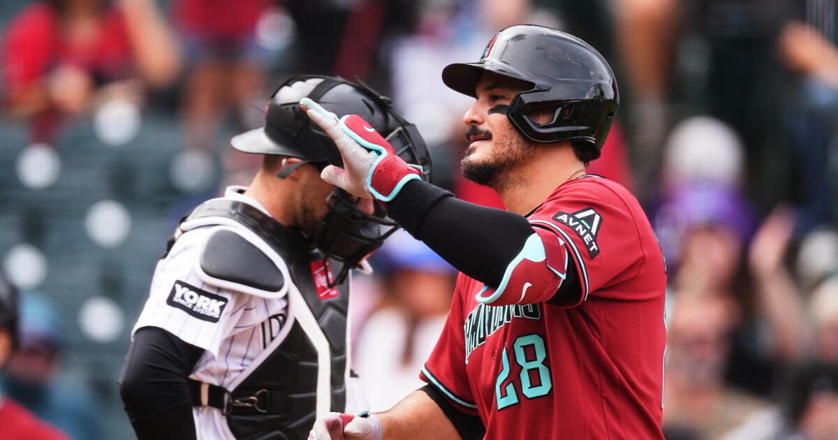Nolan Arenado hit a home run as the D-Backs beat the Rockies 12-8