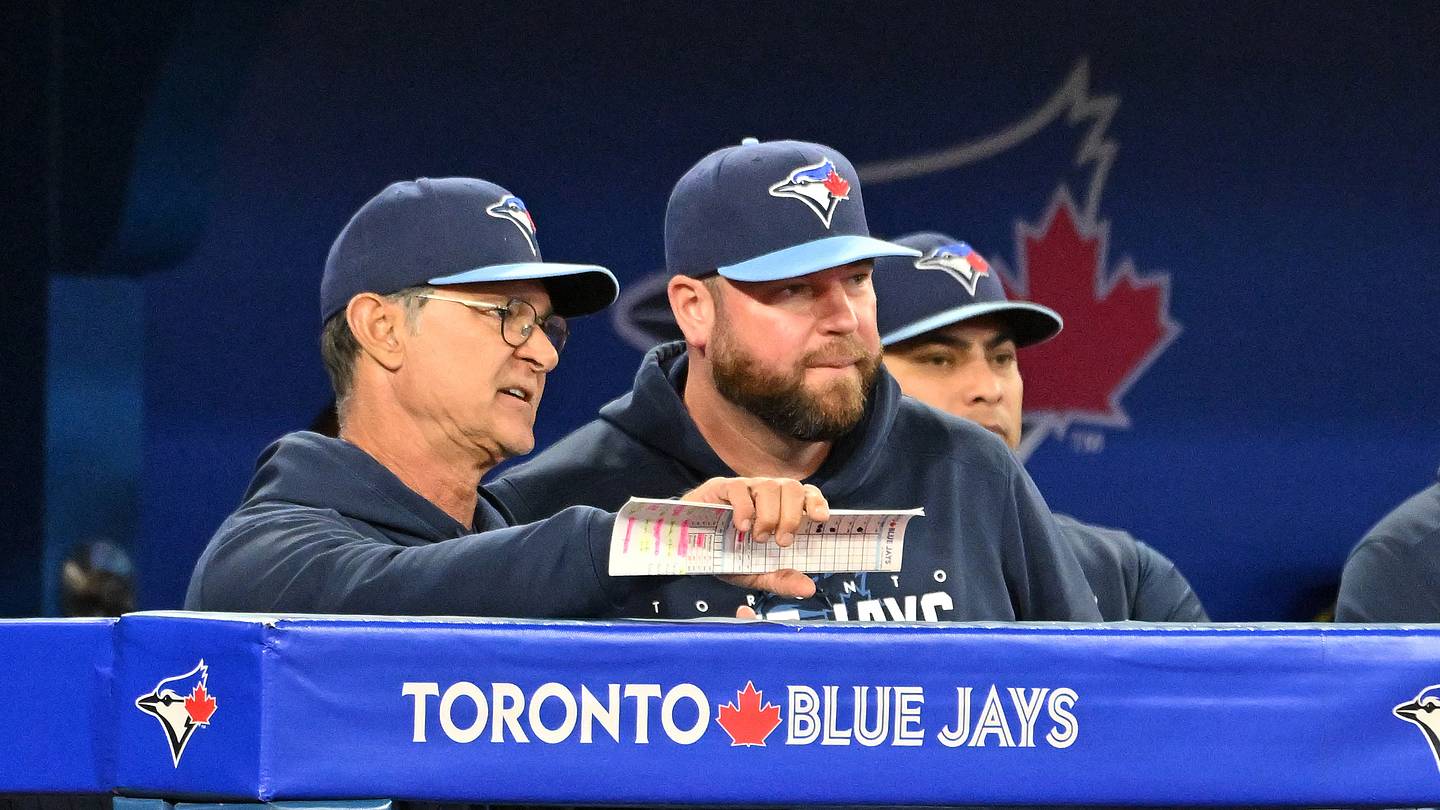 Sep 14, 2023; Toronto, Ontario, CAN;  Toronto Blue Jays bench coach Don Mattingly (23, left) speaks with manager John Schneider (14) during the seventh inning against the Texas Rangers at Rogers Centre. Mandatory Credit: Dan Hamilton-USA TODAY Sports