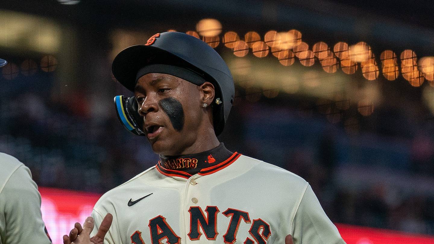 San Francisco, California, USA;  San Francisco Giants center fielder Drew Gilbert (0) and San Francisco Giants right fielder Bo Davidson (94) after scoring against the Minnesota Twins during the first inning at Oracle Park.  Mandatory Credit: Neville E. Guard-Imagn Images
