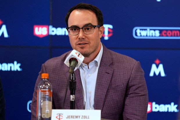 Jeremy Zoll sits behind a microphone