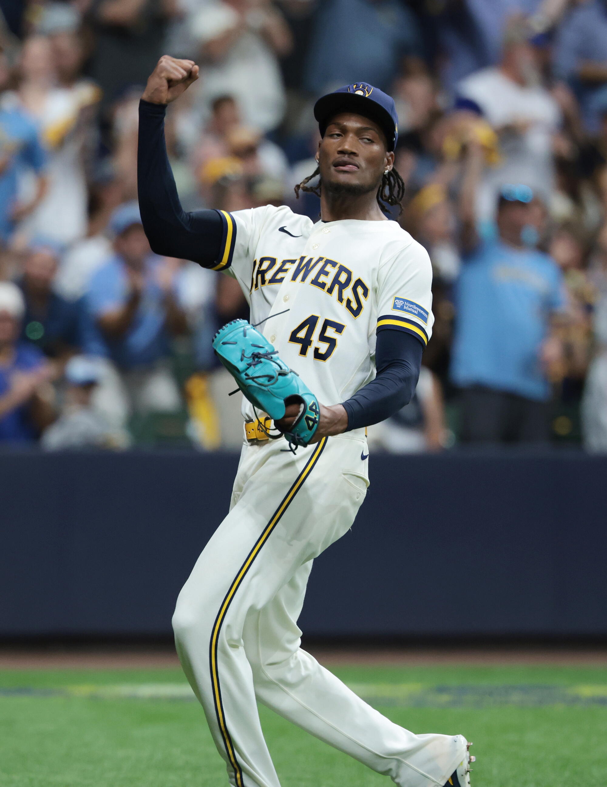 Milwaukee Brewers pitcher Abner Uribe celebrates after completing the seventh inning of Game 2 of the NLCS.