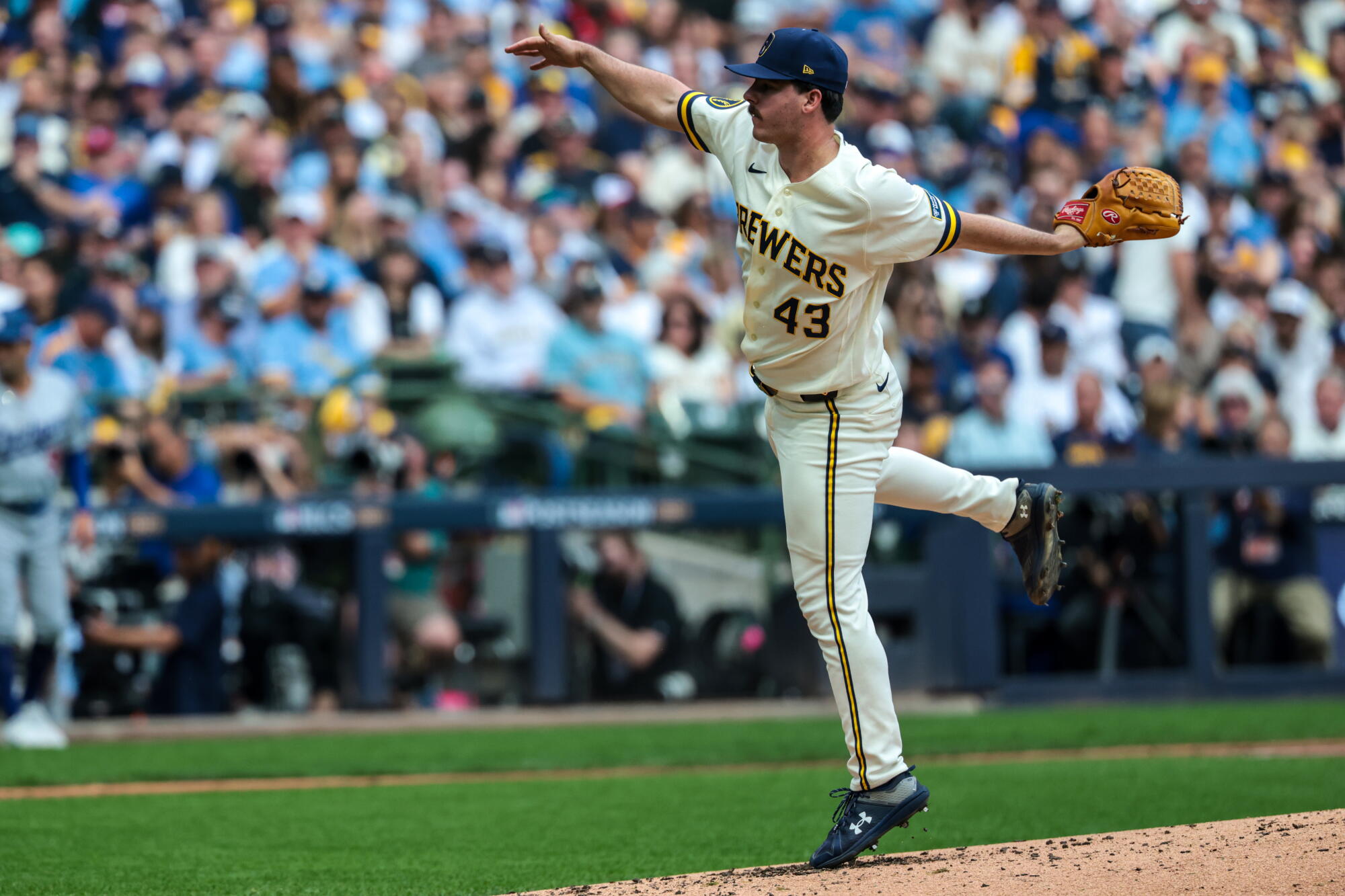 Milwaukee Brewers pitcher Logan Henderson follows through on a pitch during Game 2 of the NLCS against the Dodgers.