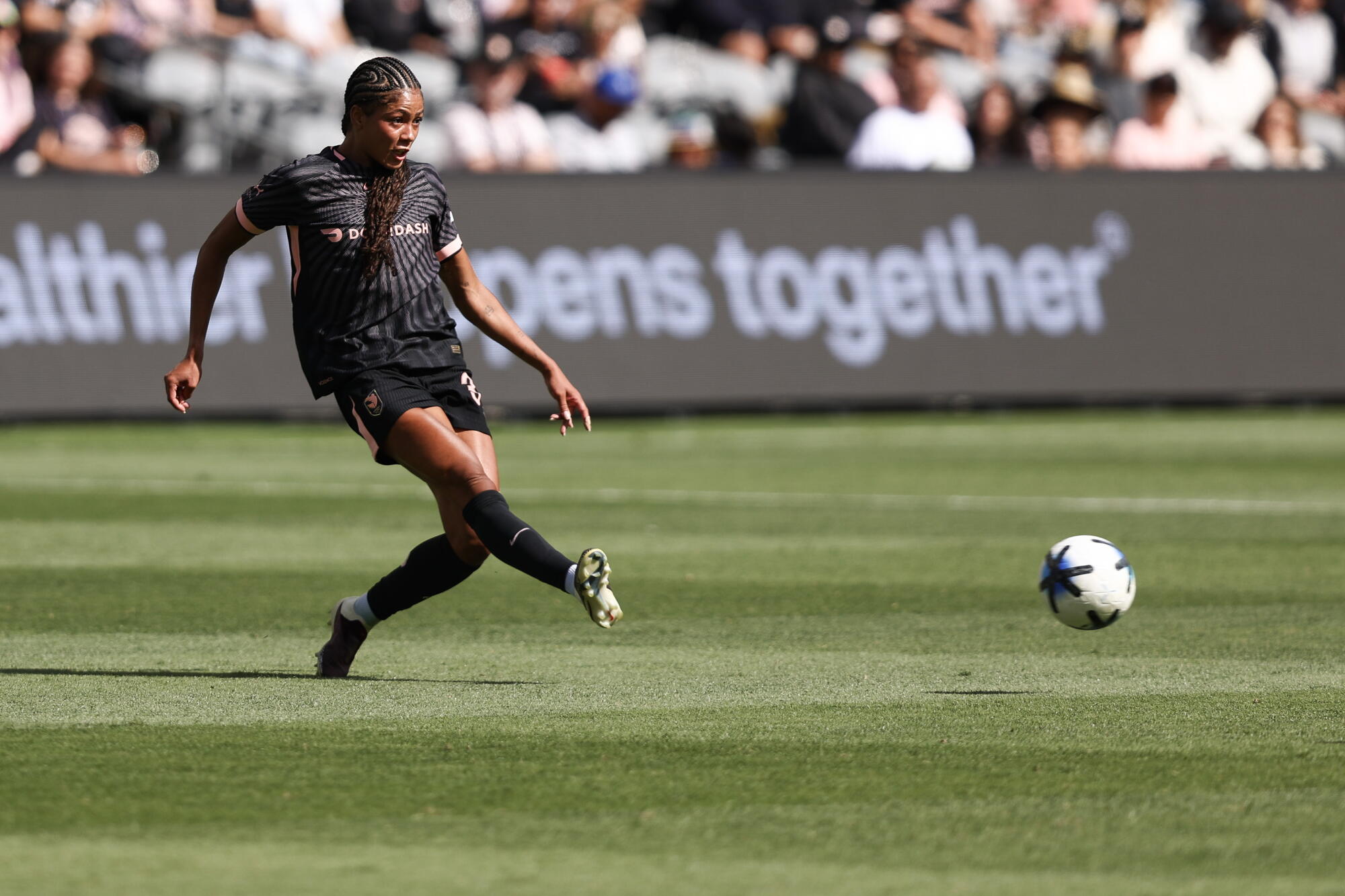 Angel City's Sveindis Jonsdottir passes during a match against Portland at BMO Stadium in April.