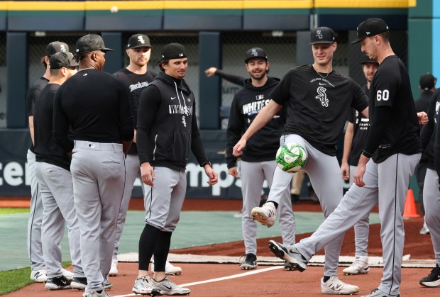 White Sox pitchers warm up with a soccer ball before Game 1 of the AL Division Series against the Guardians on Oct. 3 in Cleveland. (John J. Kim/Chicago Tribune)