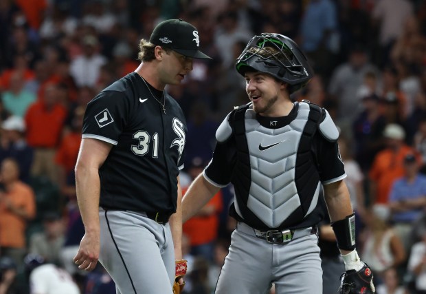 White Sox pitcher Grant Taylor, left, and catcher Kyle Teel head to the dugout after the eighth inning against the Astros in Game 1 of the wild-card series on Sept. 29, 2026, in Houston. (John J. Kim/Chicago Tribune)