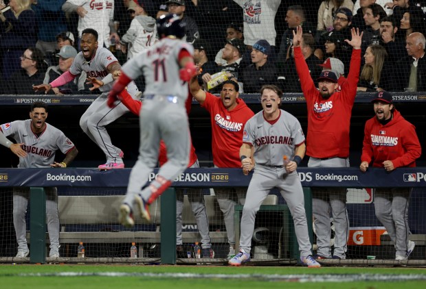 The Guardians dugout celebrates after Jose Ramirez (11) hit a two-run home run in the top of the fifth inning against the White Sox in of Game 4 of their AL Division Series on Oct. 8, 2026, at Rate Field. (Armando L. Sanchez/Chicago Tribune)