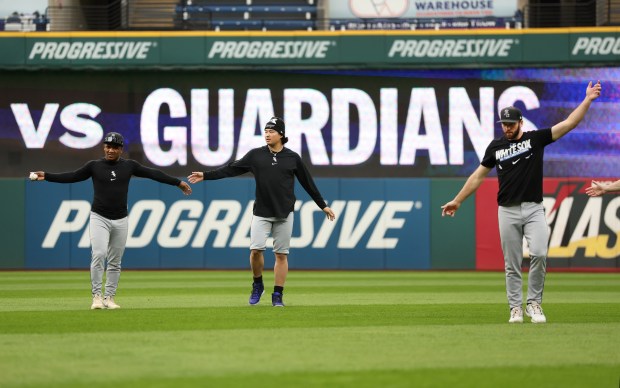 White Sox players Luisangel Acuña, from left, Munetaka Murakami and Tristan Peters warm up for Game 5 of the ALDS in Cleveland on Oct. 10, 2026. (Chris Sweda/Chicago Tribune)