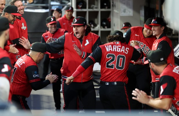 Chicago White Sox players Mike Vasil and Miguel Vargas dance in the dugout while getting loose for a game against the Colorado Rockies at Rate Field in Chicago on Sept. 25, 2026. (Chris Sweda/Chicago Tribune)