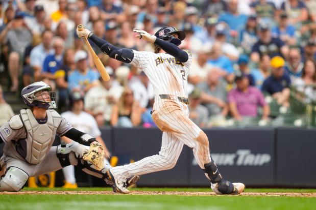 Milwaukee Brewers' Brice Turang, right, watches his home run with Colorado Rockies catcher Hunter Goodman, left, during the sixth inning of a baseball game Friday, July 24, 2026, in Milwaukee. (AP Photo/Kayla Wolf)