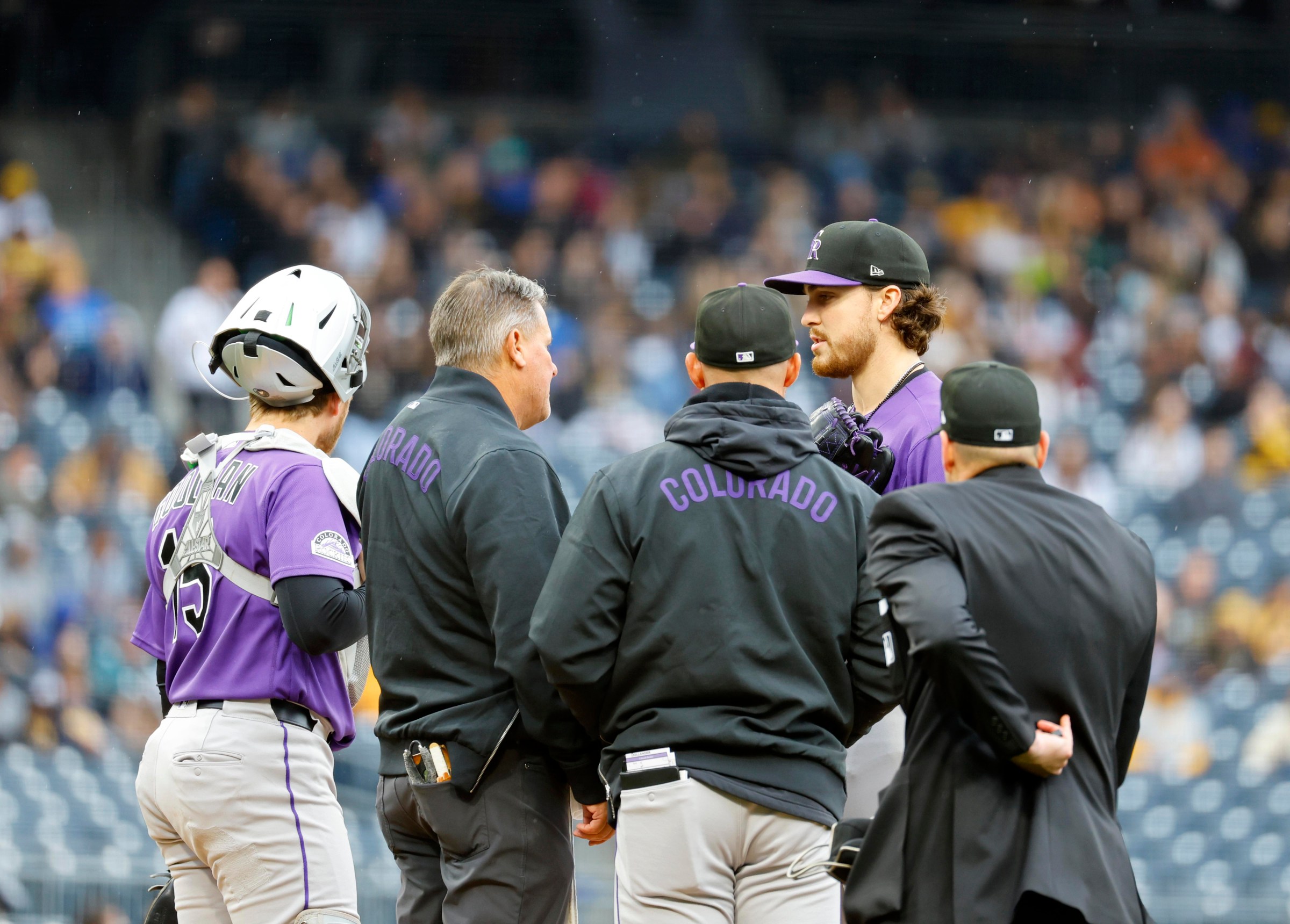 PITTSBURGH, PA - MAY 14: Chase Dollander #32 of the Colorado Rockies talks with medical staff in the second inning against the Pittsburgh Pirates at PNC Park on May 14, 2026 in Pittsburgh, Pennsylvania. (Photo by Justin K. Aller/Getty Images)