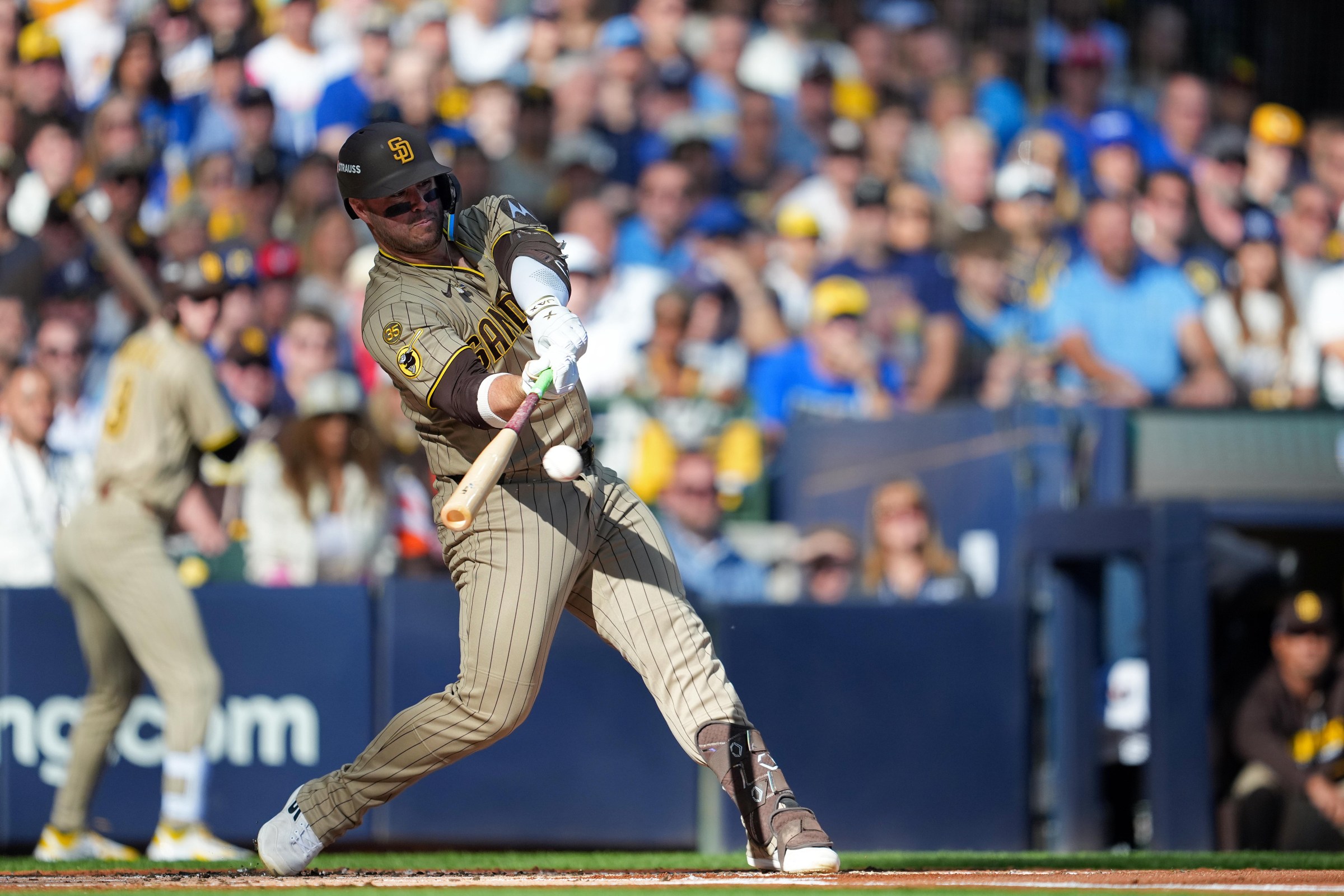 MILWAUKEE, WISCONSIN - OCTOBER 04: Ty France #25 of the San Diego Padres hits an RBI single against the San Diego Padres during the first inning in game two of the National League Division Series at American Family Field on October 04, 2026 in Milwaukee, Wisconsin. (Photo by Patrick McDermott/Getty Images)