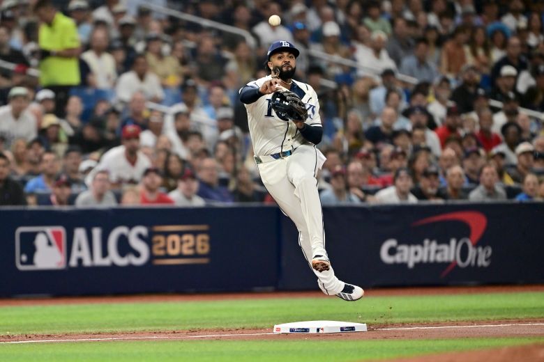 Tampa Bay's star third baseman, Junior Caminero, throws to first during Game 1 on Monday.