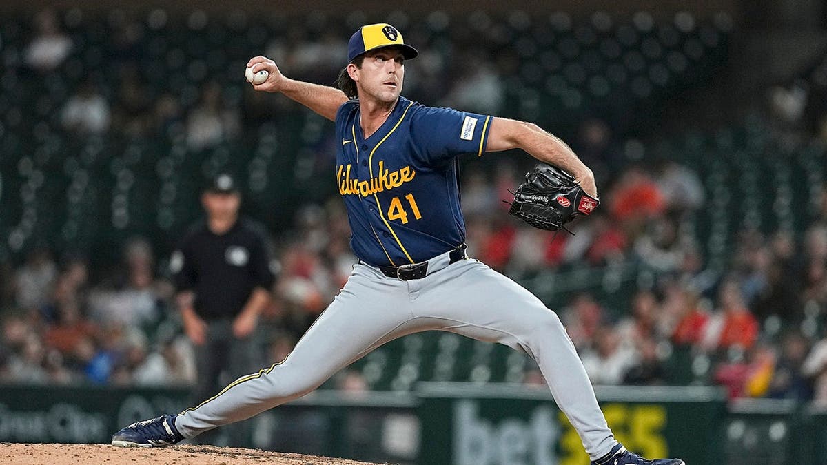 Jake Woodford pitches for the Milwaukee Brewers during a game against the Detroit Tigers.