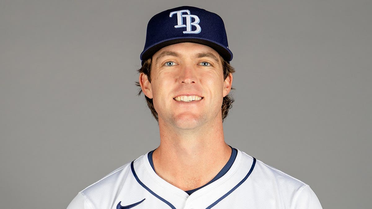 Jake Woodford poses for a photo during Tampa Bay Rays photo day at Charlotte Sports Park.