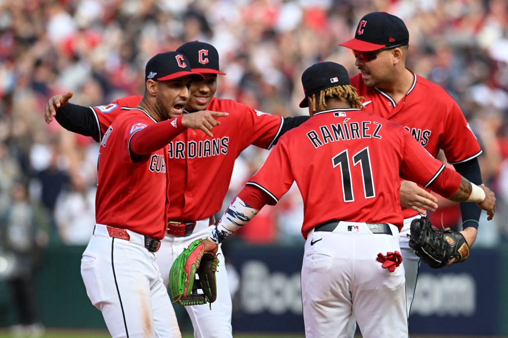 Cleveland Guardians players celebrate a win against the Tampa Bay Rays during the MLB Playoffs.