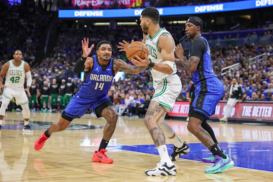 Magic guard Gary Harris and guard Kentavious Caldwell-Pope defend Celtics forward Jayson Tatum.Mike Watters-Imagn Images
