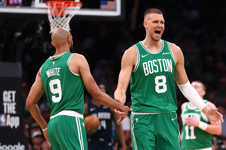 BOSTON, MASSACHUSETTS - APRIL 23: (L-R) Derrick White #9 and Kristaps Porzingis #8 of the Boston Celtics react against the Orlando Magic during the second quarter in Game Two of the Eastern Conference First Round NBA Playoffs at TD Garden on April 23, 2025 in Boston, Massachusetts. NOTE TO USER: User expressly acknowledges and agrees that, by downloading and or using this photograph, User is consenting to the terms and conditions of the Getty Images License Agreement. (Photo by Maddie Meyer/Getty Images)